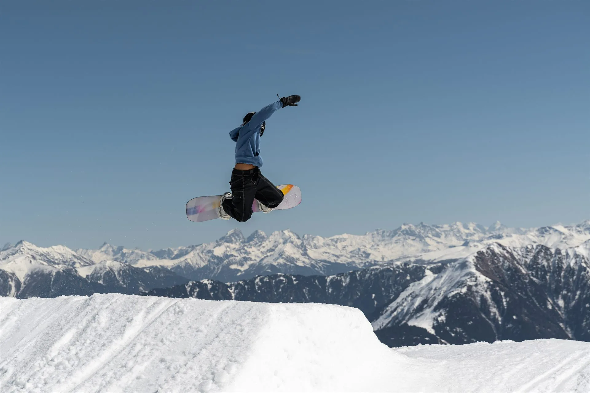 Zazi Betari, ROXY team rider, catching big air on her snowboard